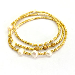 THE MAKERY TRIPLE WRAP BRACELET WITH LARGE AND SMALL PEARLS AND GOLD SEED BEADS