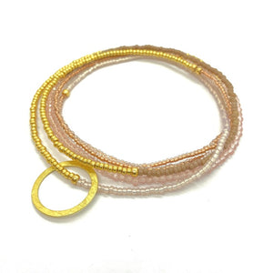 THE MAKERY HEART STRING LONG NECKLACE IN NUDE GOLD AND PEARL