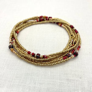 THE MAKERY LONG CHAMPAGNE GOLD WRAP BRACELET WITH RED TRADE BEADS