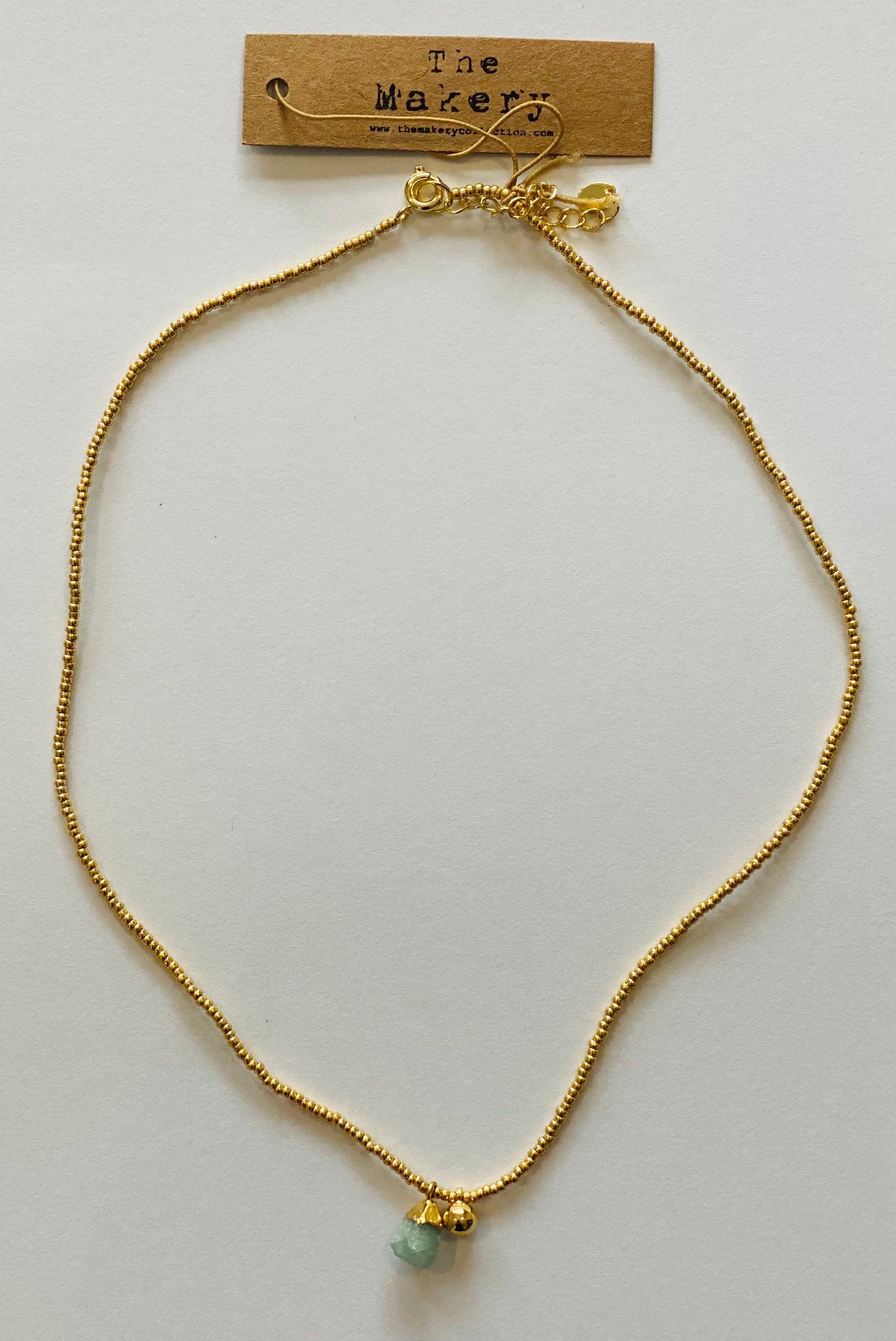 THE MAKERY SHORT GOLD NECKLACE WITH ROUGH GEM AND BEAD